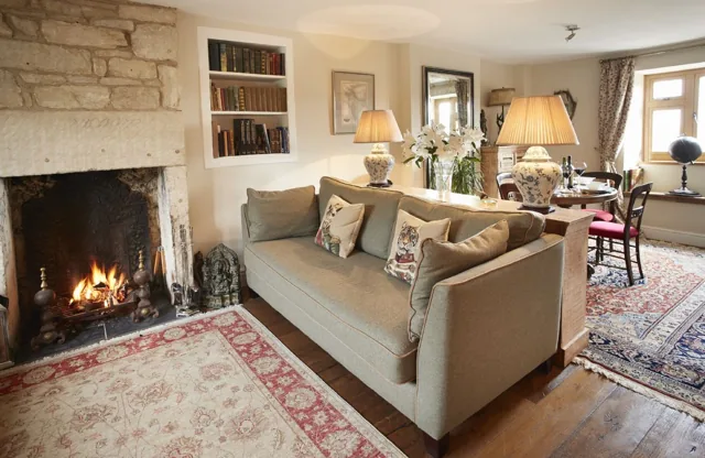 Open fire and sofas at 39 Foxtail Cottage in Blockley